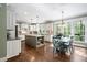 Large kitchen featuring an island, stainless appliances, and an adjacent dining area with backyard views at 4121 Enfield Ridge Dr, Cary, NC 27519