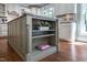 Kitchen island with shelving and quartz countertops at 4121 Enfield Ridge Dr, Cary, NC 27519