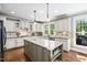 Expansive kitchen with granite countertops, a central island, and a dining area at 4121 Enfield Ridge Dr, Cary, NC 27519