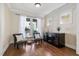 Bright living room with hardwood floors, large windows, and stylish furnishings at 4121 Enfield Ridge Dr, Cary, NC 27519