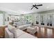 Open-concept living room with hardwood floors that connects to the gourmet kitchen at 4121 Enfield Ridge Dr, Cary, NC 27519