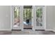 View of porch with a fire pit, seating, and serene outdoor space, accessible through French doors at 4121 Enfield Ridge Dr, Cary, NC 27519