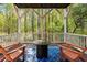 A covered porch featuring outdoor seating and a fire pit offers an idyllic retreat at 4121 Enfield Ridge Dr, Cary, NC 27519