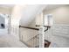 Upstairs hallway featuring wainscoting and a carpeted floor at 4121 Enfield Ridge Dr, Cary, NC 27519