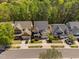 Aerial view of homes along the street, with mature trees and well-manicured lawns at 4121 Enfield Ridge Dr, Cary, NC 27519
