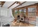 Bathroom featuring tile flooring, bathtub, plants, and a window providing natural light and views of the outdoors at 4401 E L G Rd, Efland, NC 27243