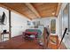 Cozy bedroom with wood floors, comfortable bed, and private deck at 4401 E L G Rd, Efland, NC 27243