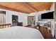 Comfortable bedroom with wood floors, art, and large windows at 4401 E L G Rd, Efland, NC 27243