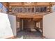 Interior log cabin garage with overhead lighting, windows and storage space set amidst wooden logs and a concrete floor at 4401 E L G Rd, Efland, NC 27243