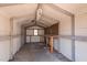 Simple shed interior with workbench, and adequate lighting, offering a functional workspace at 4401 E L G Rd, Efland, NC 27243