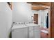 Bright laundry area features side-by-side washer and dryer at 4401 E L G Rd, Efland, NC 27243