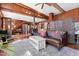 Open-concept living space featuring wood accents, comfortable seating, and a view into the kitchen at 4401 E L G Rd, Efland, NC 27243