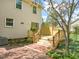 Backyard boasts a wooden deck, brick patio, and mature trees, creating a private and relaxing outdoor space at 4508 Fox Rd, Raleigh, NC 27616