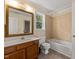 Cozy bathroom with tub/shower, linoleum flooring, and ample mirror space at 4508 Fox Rd, Raleigh, NC 27616