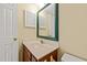 Charming bathroom with decorative mirror, wood vanity, and neutral color scheme at 4508 Fox Rd, Raleigh, NC 27616