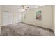 Bright bedroom with two windows offering pleasant outdoor views and plush carpeting at 4508 Fox Rd, Raleigh, NC 27616