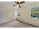 Bedroom featuring a window with an outdoor view and a ceiling fan at 4508 Fox Rd, Raleigh, NC 27616