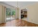Cozy dining area with hardwood floors, chandelier, and sliding door to backyard deck at 4508 Fox Rd, Raleigh, NC 27616