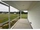 A screened back porch overlooks expansive backyard space and lawn at 47 Silver Ct, Smithfield, NC 27577