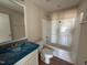 Bathroom with a single sink vanity, mirror, and shower-tub combination at 47 Silver Ct, Smithfield, NC 27577