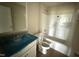 A bathroom with a single sink, granite countertops, toilet, and shower/tub combo at 47 Silver Ct, Smithfield, NC 27577
