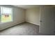 Cozy bedroom with neutral walls, carpet and a bright window looking at the outside at 47 Silver Ct, Smithfield, NC 27577