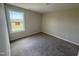 This carpeted bedroom boasts a bright window, neutral walls, and plenty of room at 47 Silver Ct, Smithfield, NC 27577