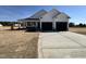 Charming one-story home with a two-car garage and a welcoming front porch at 47 Silver Ct, Smithfield, NC 27577