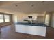 Bright kitchen boasts a large island, lots of countertop space, and modern appliances at 47 Silver Ct, Smithfield, NC 27577