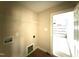 Functional laundry room with shelving, an electrical outlet and an exit door at 47 Silver Ct, Smithfield, NC 27577