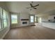 Bright living room with hardwood floors, a fireplace and large windows at 47 Silver Ct, Smithfield, NC 27577