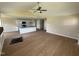 Bright open living space featuring wood floor, vaulted ceiling, ceiling fan, and eat-in kitchen island at 47 Silver Ct, Smithfield, NC 27577