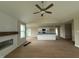 Bright living room with hardwood floors and open floor plan connects to kitchen at 47 Silver Ct, Smithfield, NC 27577