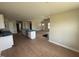 Bright open living space featuring wood floor, vaulted ceiling and view to front entry at 47 Silver Ct, Smithfield, NC 27577