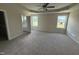 Spacious primary bedroom featuring tray ceiling, carpet, and ensuite bathroom with tub and walk-in shower at 47 Silver Ct, Smithfield, NC 27577