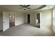 Spacious main bedroom with tray ceilings and multiple doorways to other rooms at 47 Silver Ct, Smithfield, NC 27577