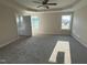 A Primary bedroom with tray ceilings, carpet and attached bathroom at 47 Silver Ct, Smithfield, NC 27577