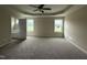 Spacious main bedroom with tray ceilings and a doorway to the main bathroom at 47 Silver Ct, Smithfield, NC 27577