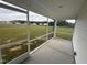 This screened porch offers an amazing view of the green backyard and surrounding landscape at 47 Silver Ct, Smithfield, NC 27577