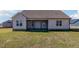 View of the back of the home featuring a screened porch and large backyard at 48 Tanseyleaf Dr, Smithfield, NC 27577