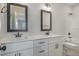 Bathroom features double sinks with modern fixtures and black framed mirrors at 48 Tanseyleaf Dr, Smithfield, NC 27577