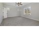 Spacious bedroom with carpeted floors, natural light, and ceiling fan at 48 Tanseyleaf Dr, Smithfield, NC 27577