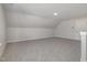 Spacious bonus room with plush carpet and a crisp white trim at 48 Tanseyleaf Dr, Smithfield, NC 27577