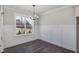 Dining room with hardwood floors, wainscoting, and natural light at 48 Tanseyleaf Dr, Smithfield, NC 27577