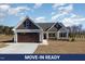 Charming home with brown garage door, light siding, and covered entrance at 48 Tanseyleaf Dr, Smithfield, NC 27577