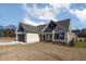 Charming home with light siding, covered entrance, and manicured lawn at 48 Tanseyleaf Dr, Smithfield, NC 27577