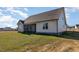 Rear exterior view of a home with a screened porch and green lawn at 48 Tanseyleaf Dr, Smithfield, NC 27577