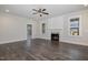 Spacious living room featuring a fireplace, hardwood floors, and natural light at 48 Tanseyleaf Dr, Smithfield, NC 27577