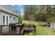 Exterior view of a well maintained wooden deck and a view into the backyard at 4810 Mitchell Mill Rd, Wake Forest, NC 27587