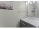 Stylish half-bathroom with a modern vanity, marble countertop, and elegant fixtures at 4810 Mitchell Mill Rd, Wake Forest, NC 27587